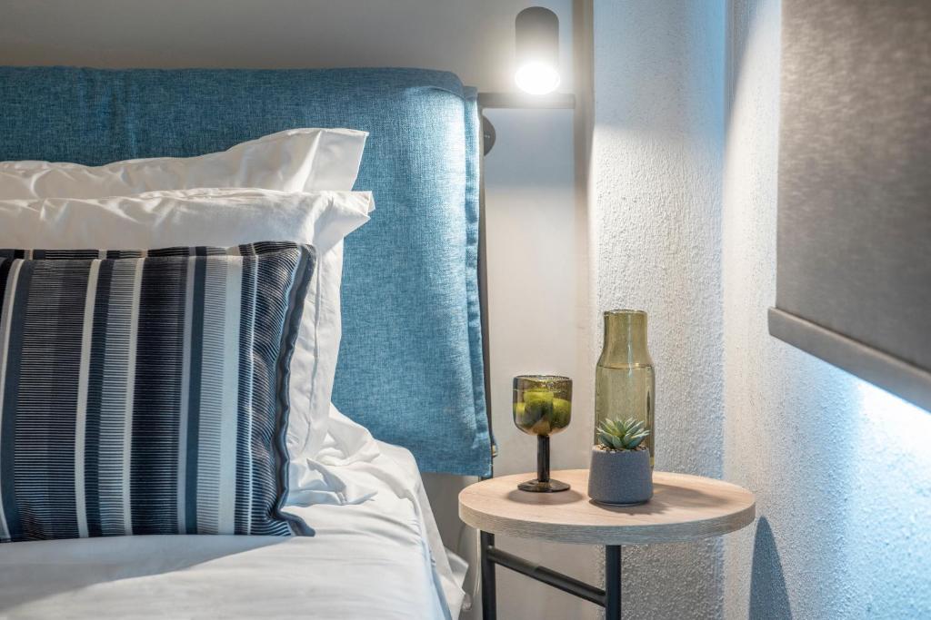 Postel nebo postele na pokoji v ubytování Heraclea Luxury Suites