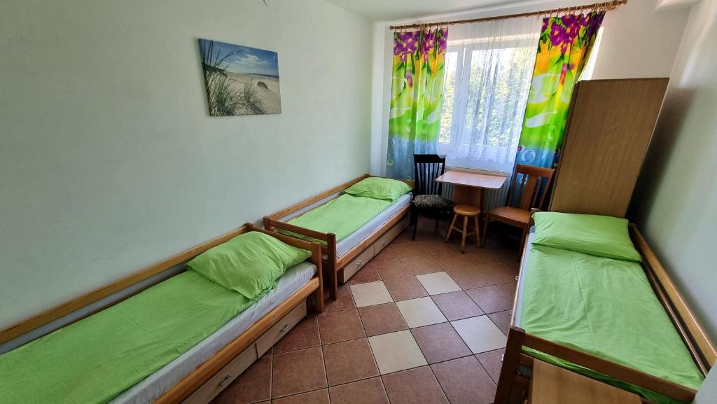 Posteľ alebo postele v izbe v ubytovaní Ośrodek BEATA / FIORD