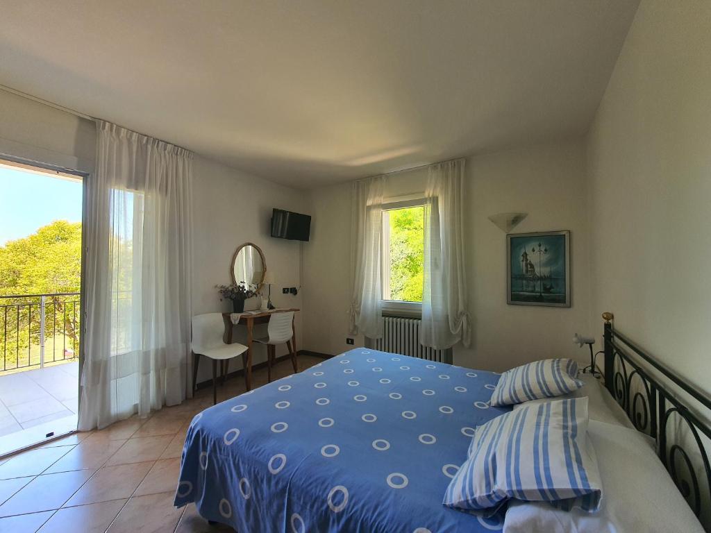 Postel nebo postele na pokoji v ubytování Albergo Campagnola