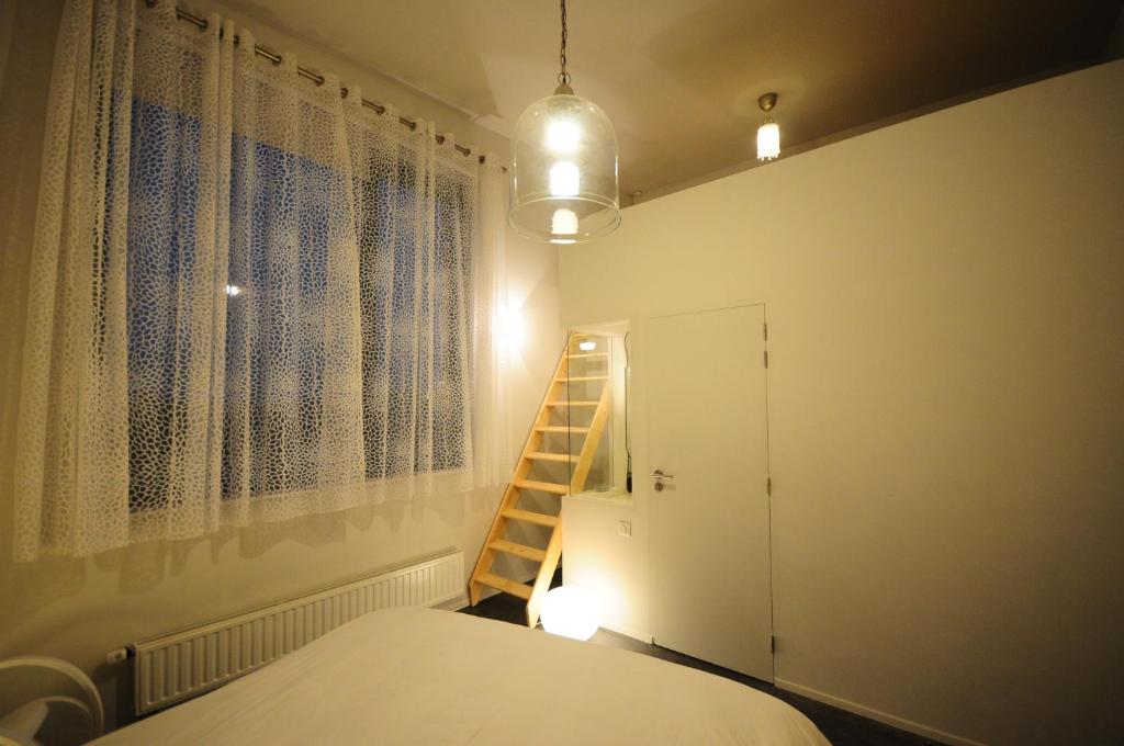 Postel nebo postele na pokoji v ubytování Maison d'Hôtes Cerf'titude
