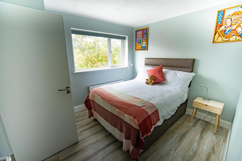 Postel nebo postele na pokoji v ubytování Half Door House