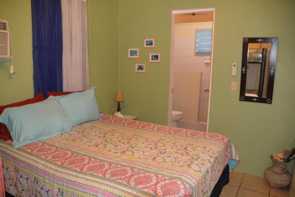 Postel nebo postele na pokoji v ubytování Palmetto Guesthouse