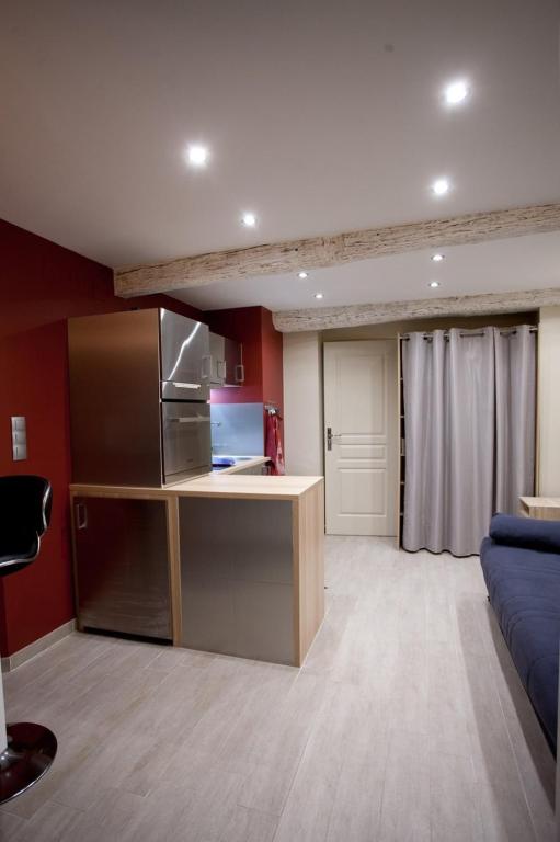 a large room with a kitchen and a living room at Very Nice Studio Ideal For 2 Near The Halles in Avignon