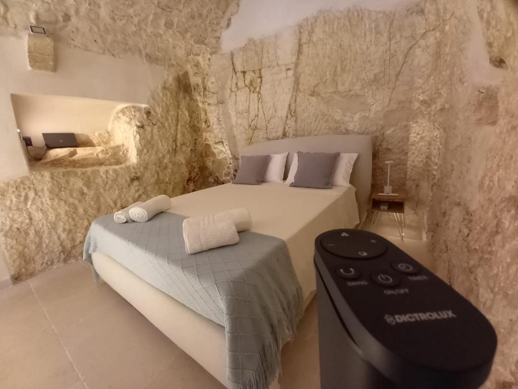 Postel nebo postele na pokoji v ubytování Cà sotto l’arco