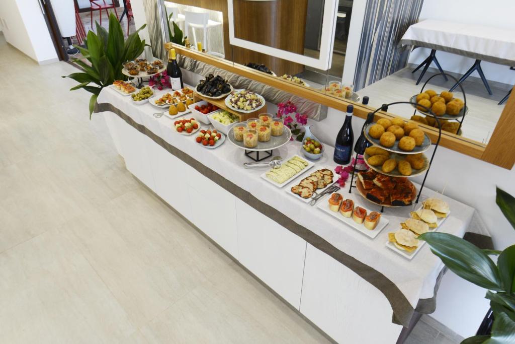 a buffet with many different types of food at Best Western Hotel Martello in Lampedusa