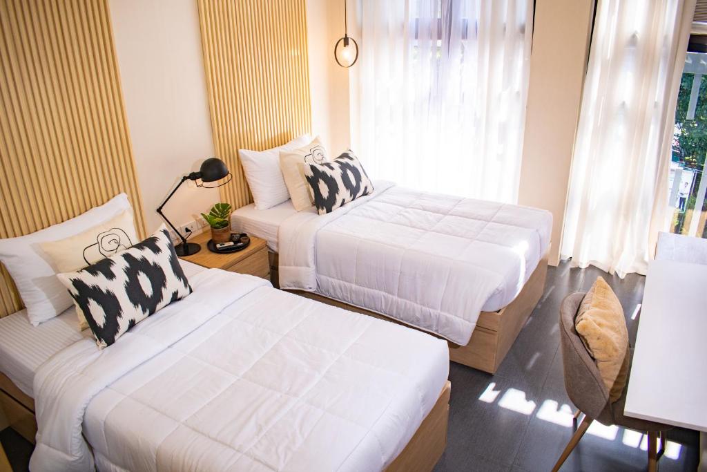 Кровать или кровати в номере D' Residences