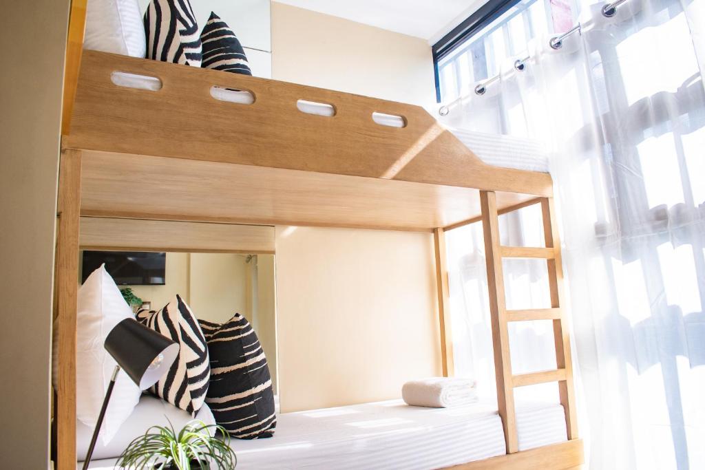 Postel nebo postele na pokoji v ubytování D' Residences