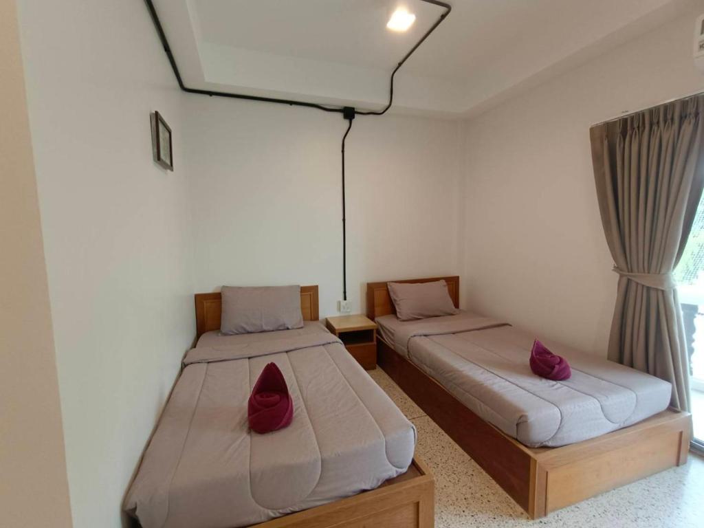 Postel nebo postele na pokoji v ubytování Bangsaphan Resort