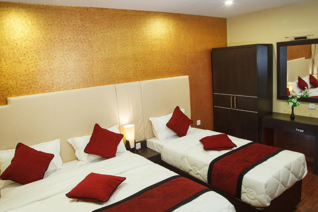 Postel nebo postele na pokoji v ubytování Hotel Meridian Suite