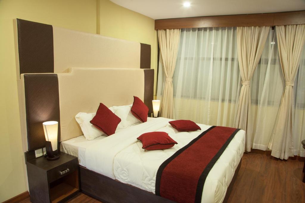 Postel nebo postele na pokoji v ubytování Hotel Meridian Suite