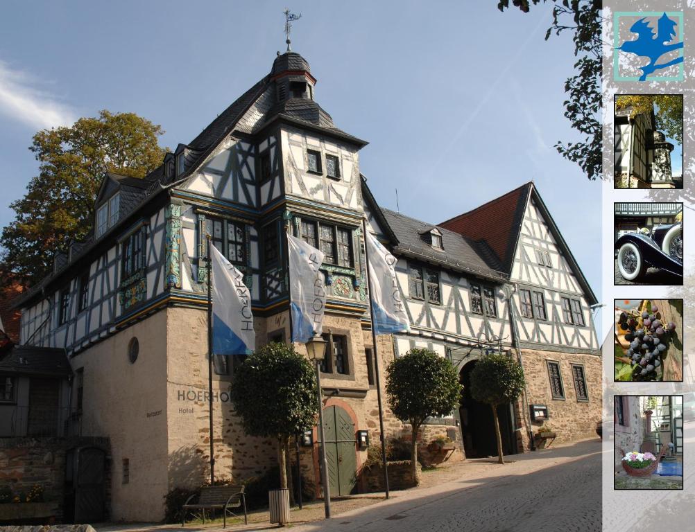 un vecchio edificio con una croce sopra di Restaurant & ****Hotel HÖERHOF a Idstein