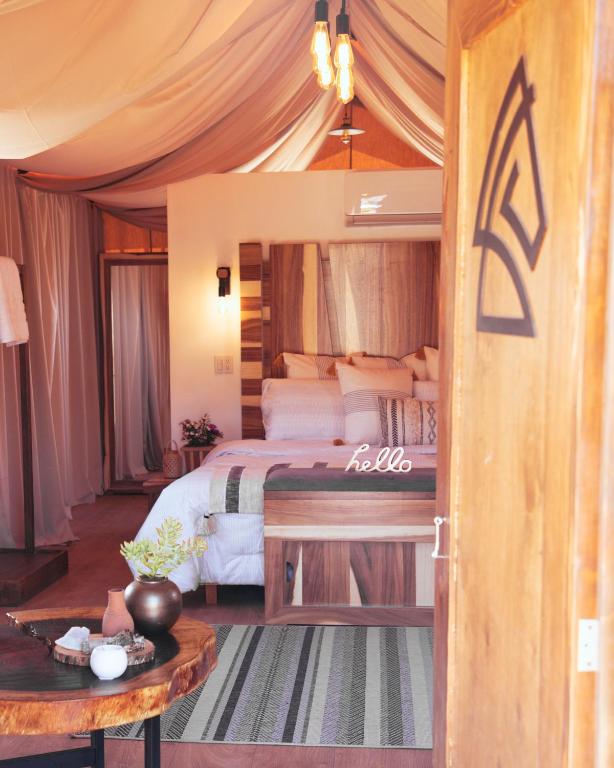 Postel nebo postele na pokoji v ubytování Indomito Resort & Hotel Boutique