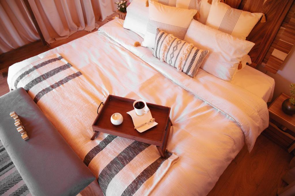 Postel nebo postele na pokoji v ubytování Indomito Resort & Hotel Boutique
