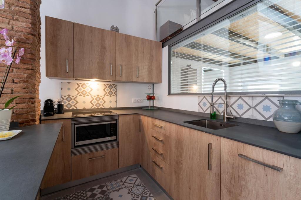 Kuchyň nebo kuchyňský kout v ubytování Suite Loft 4 PAX by costablancarent