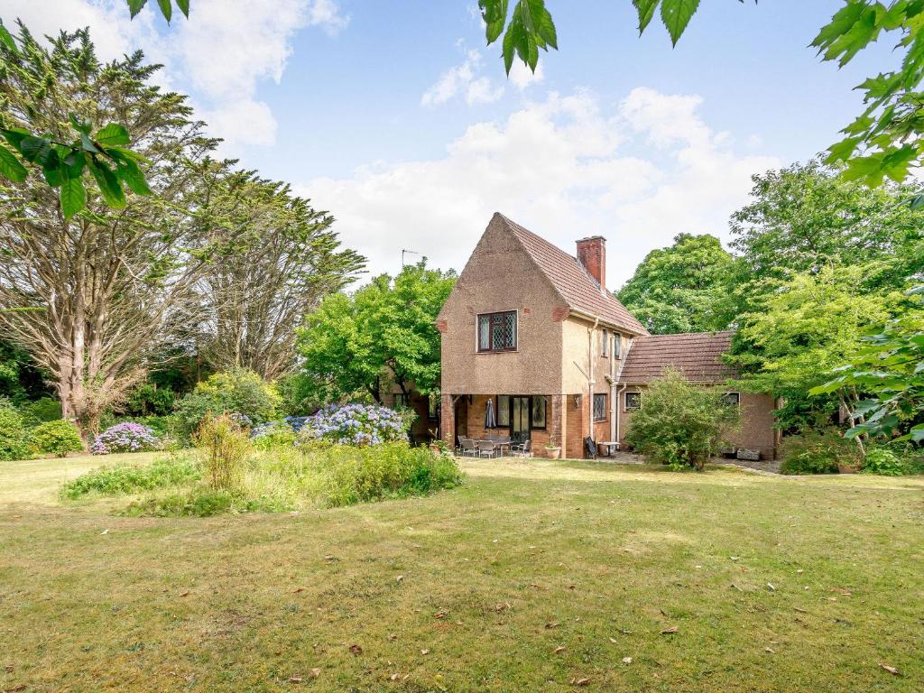 an old farm house with a grass yard at Longsdon in Haverfordwest