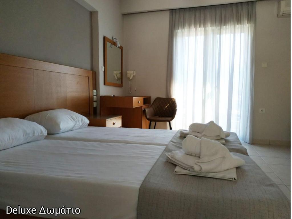 Posteľ alebo postele v izbe v ubytovaní Evita's Resort