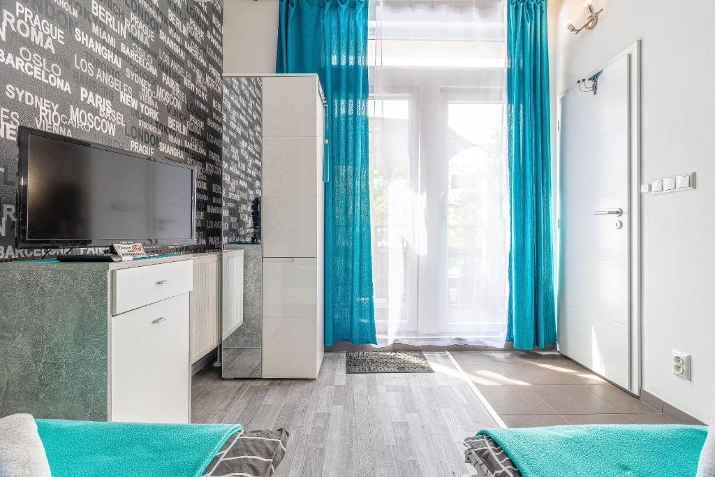 A television and/or entertainment centre at Bratislava -apartment near the City center with a balcony