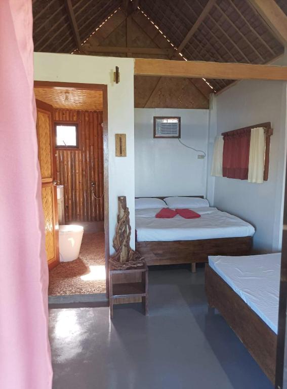 Postel nebo postele na pokoji v ubytování OcamOcam Azur Inn