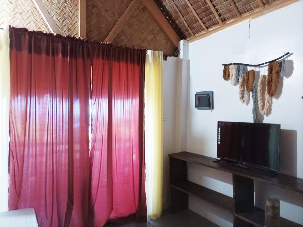 TV a/nebo společenská místnost v ubytování OcamOcam Azur Inn