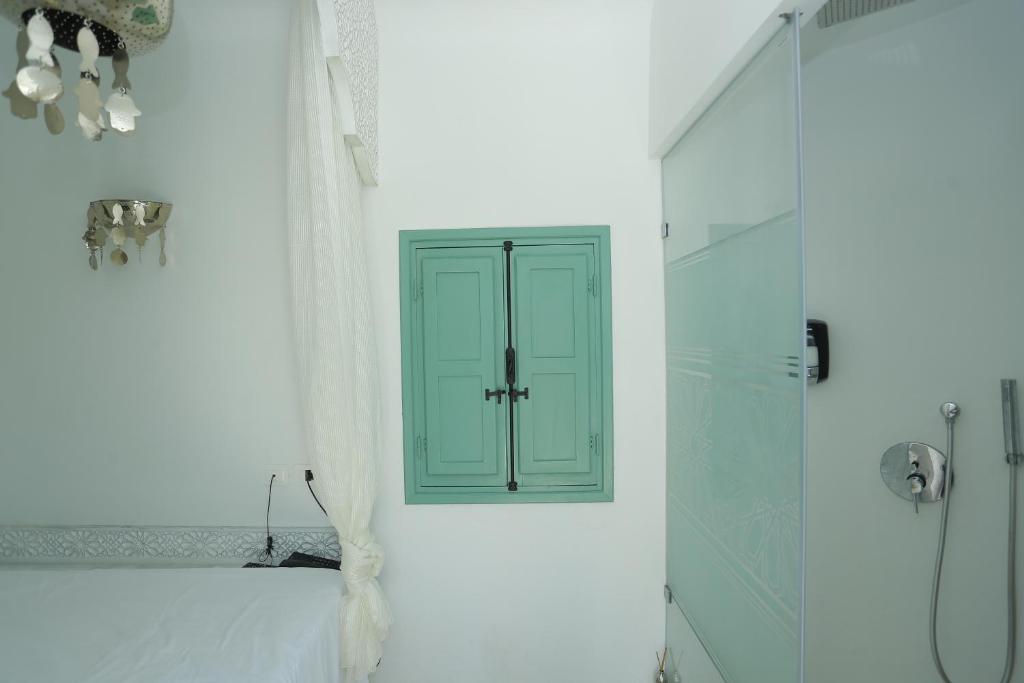 Postel nebo postele na pokoji v ubytování Dar Hammamet Guest House & Hammam
