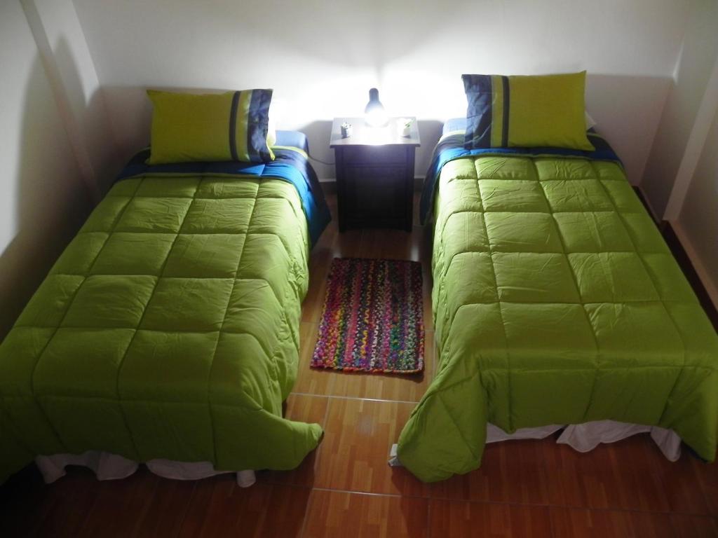 Uma cama ou camas num quarto em Hostal Siete Colores
