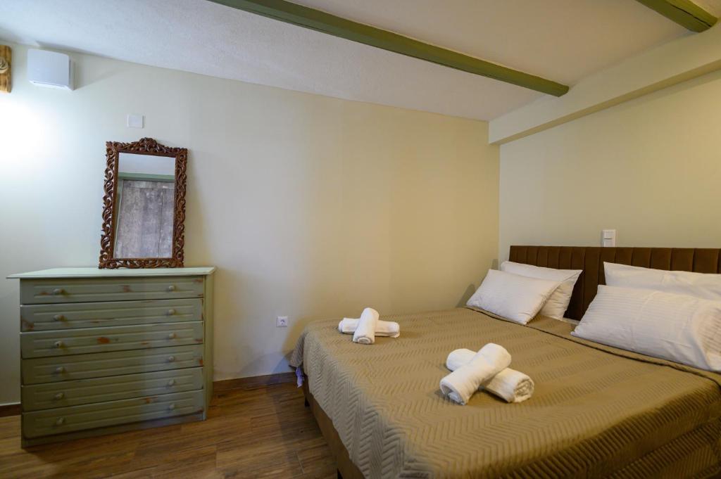 A bed or beds in a room at Kalochori Luxury Cottage