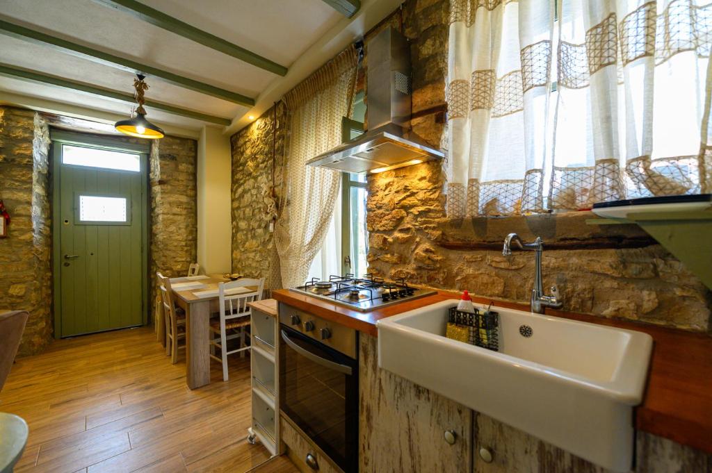 A kitchen or kitchenette at Kalochori Luxury Cottage