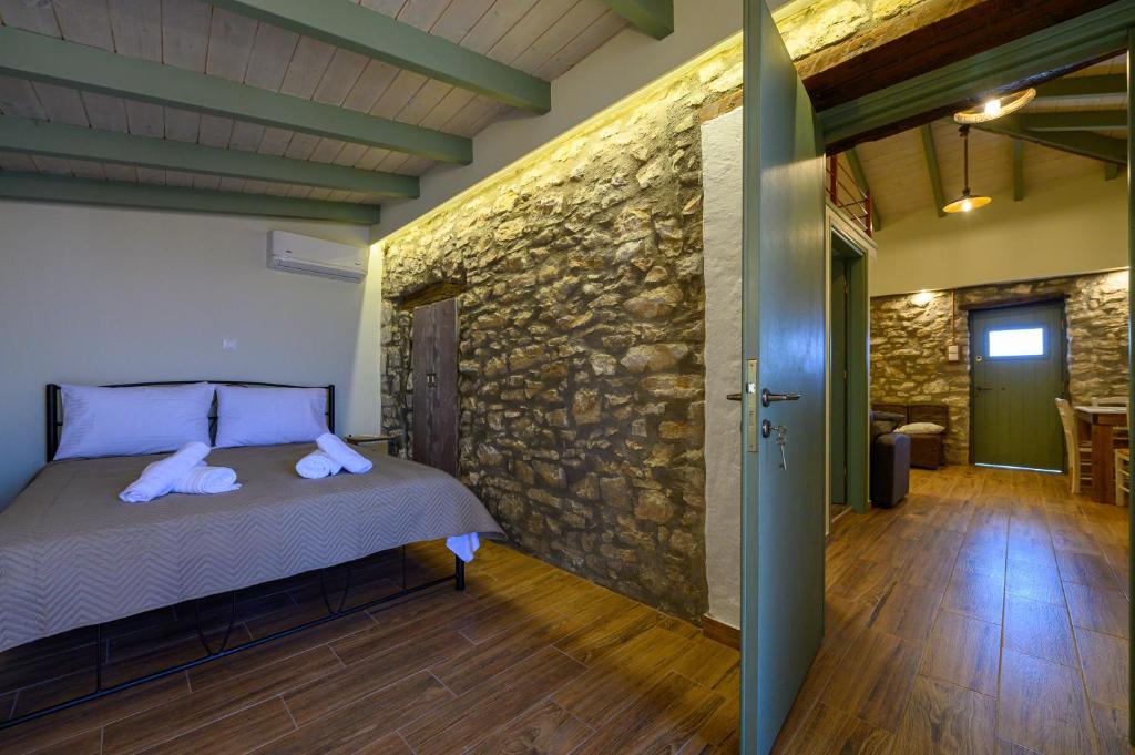 A bed or beds in a room at Kalochori Luxury Cottage
