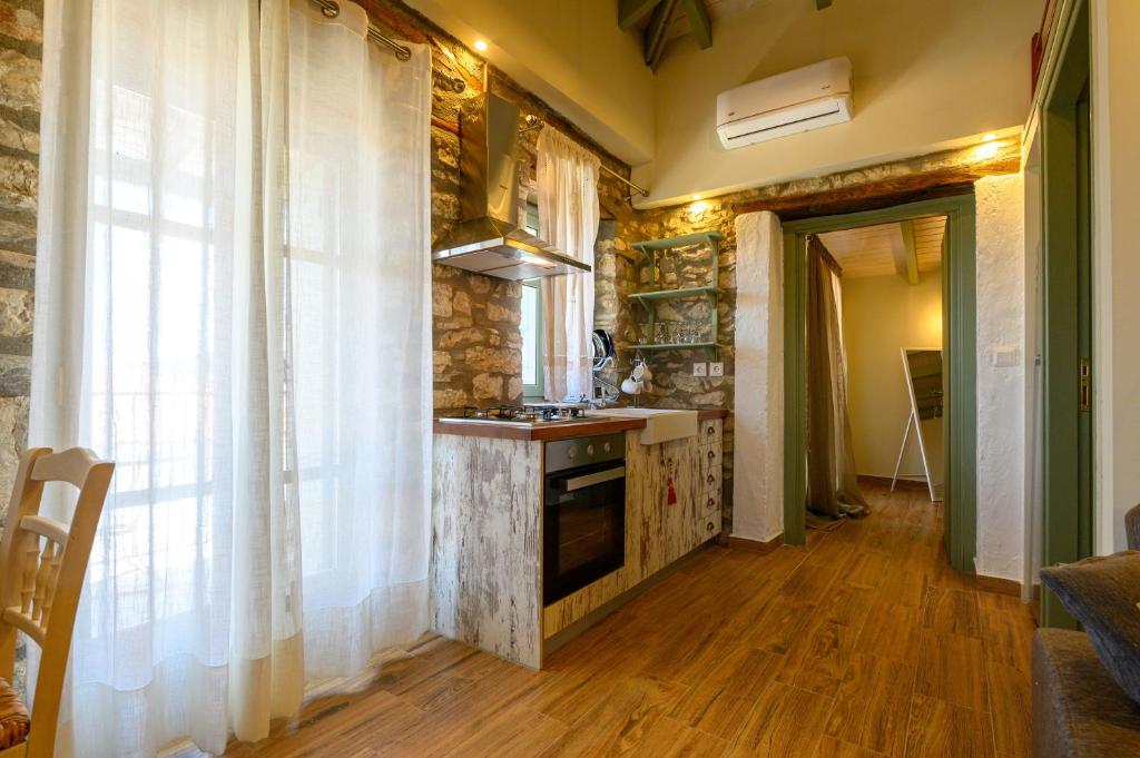 A kitchen or kitchenette at Kalochori Luxury Cottage