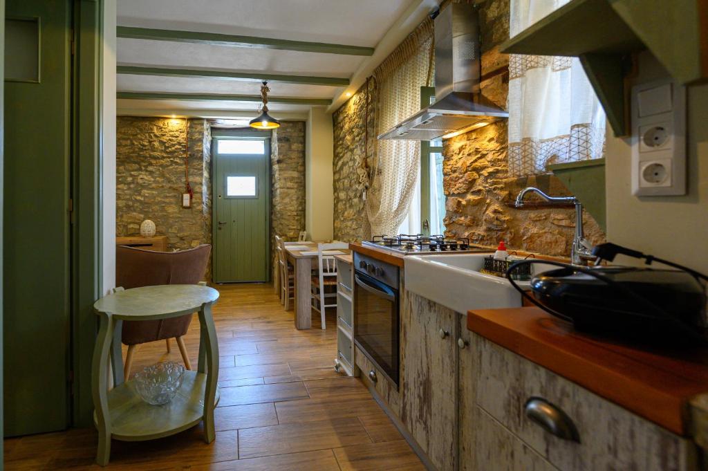 A kitchen or kitchenette at Kalochori Luxury Cottage