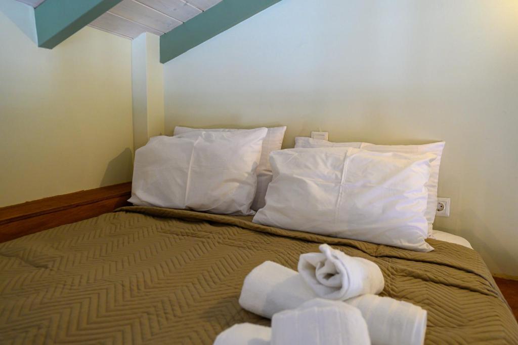 A bed or beds in a room at Kalochori Luxury Cottage