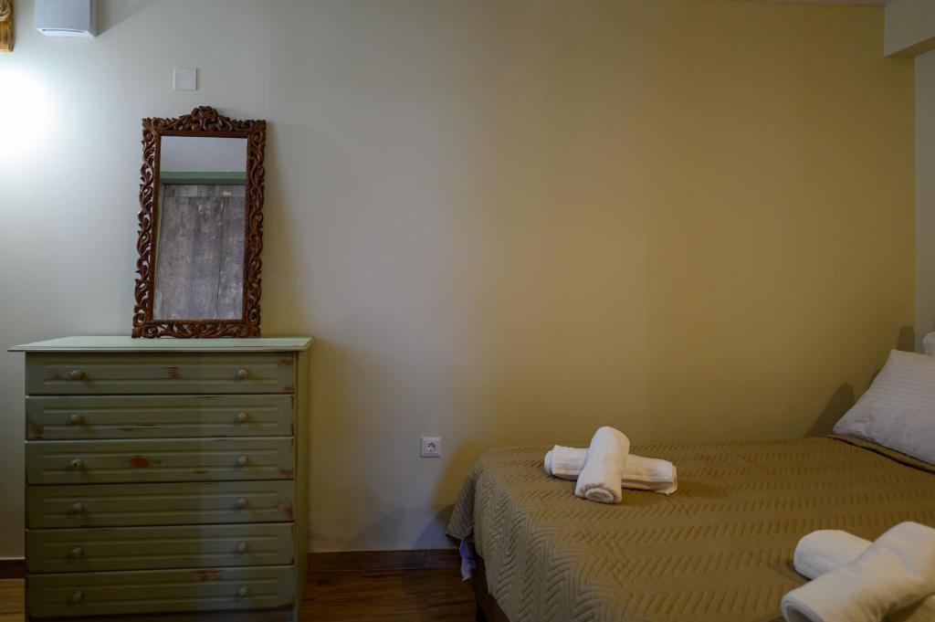 A bed or beds in a room at Kalochori Luxury Cottage