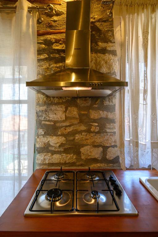 A kitchen or kitchenette at Kalochori Luxury Cottage