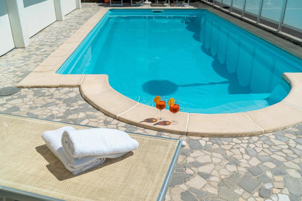 Bazén v ubytování Hotel Villa d'Este nebo v jeho okolí