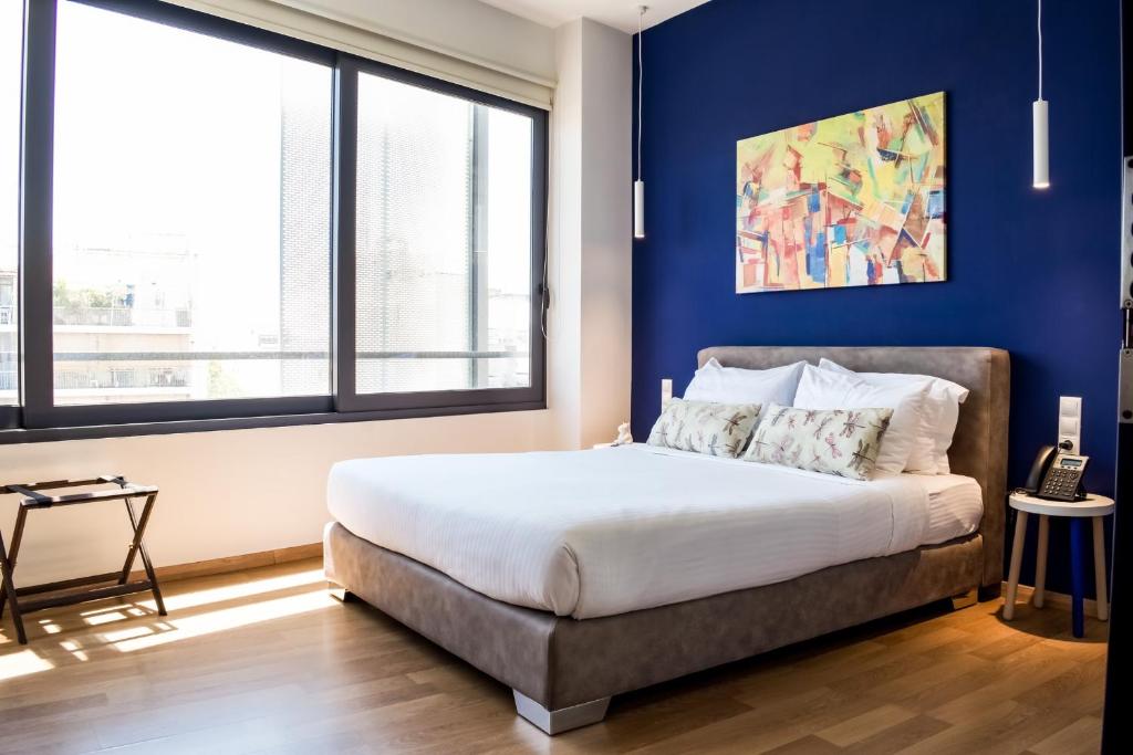 Postel nebo postele na pokoji v ubytování Iasonos Suites Athens