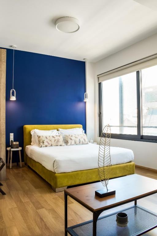 Postel nebo postele na pokoji v ubytování Iasonos Suites Athens