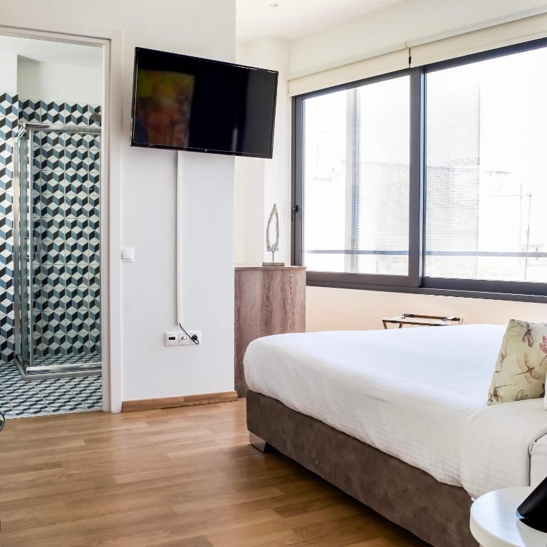Postel nebo postele na pokoji v ubytování Iasonos Suites Athens