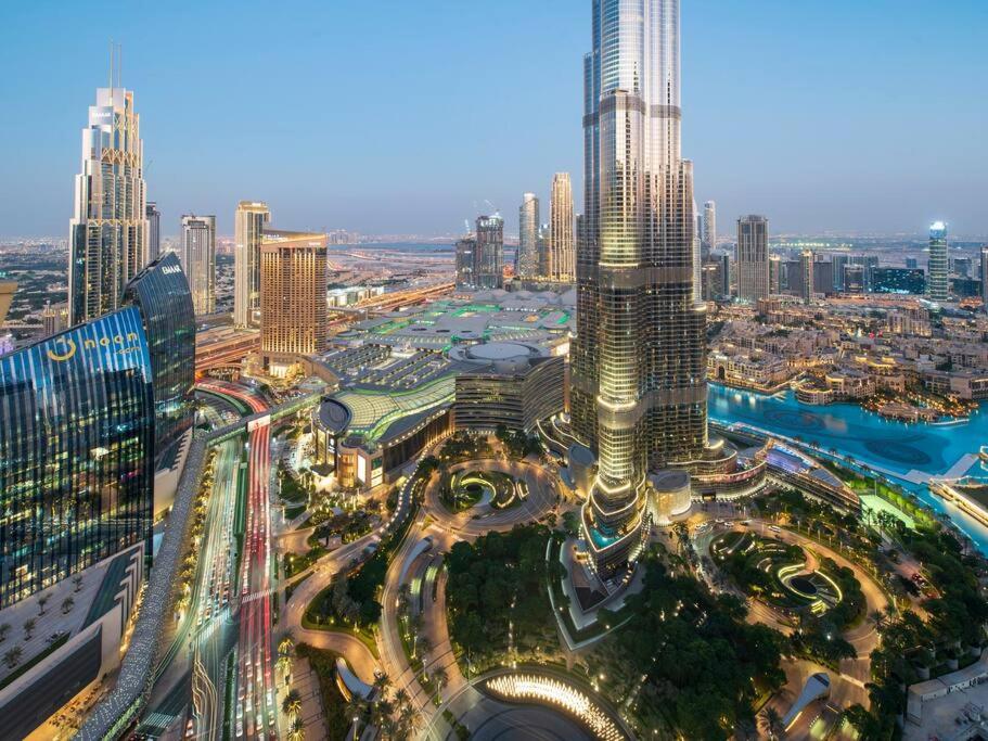 an aerial view of a city with a tall skyscraper at WORLD CLASS 3BR with full BURJ KHALIFA and FOUNTAIN VIEW in Dubai