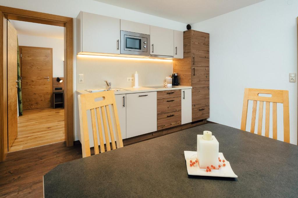 Kuchyň nebo kuchyňský kout v ubytování Hotel Garni Jägerheim