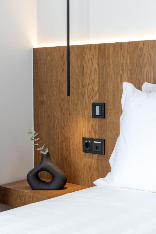 A bed or beds in a room at Neoma