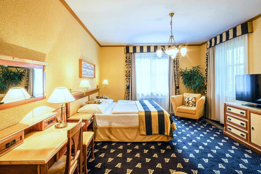 Postel nebo postele na pokoji v ubytování Hotel Richard Spa & Wellness