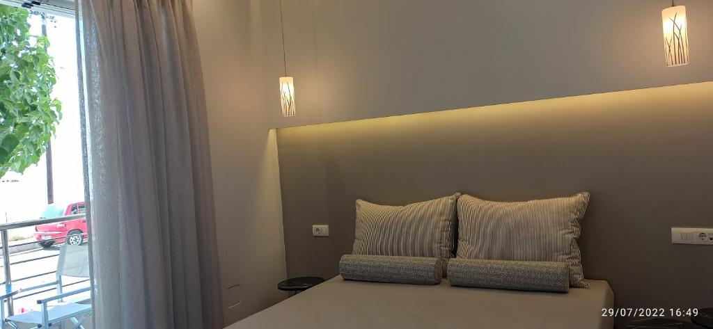 A bed or beds in a room at ERODIOS TOWN