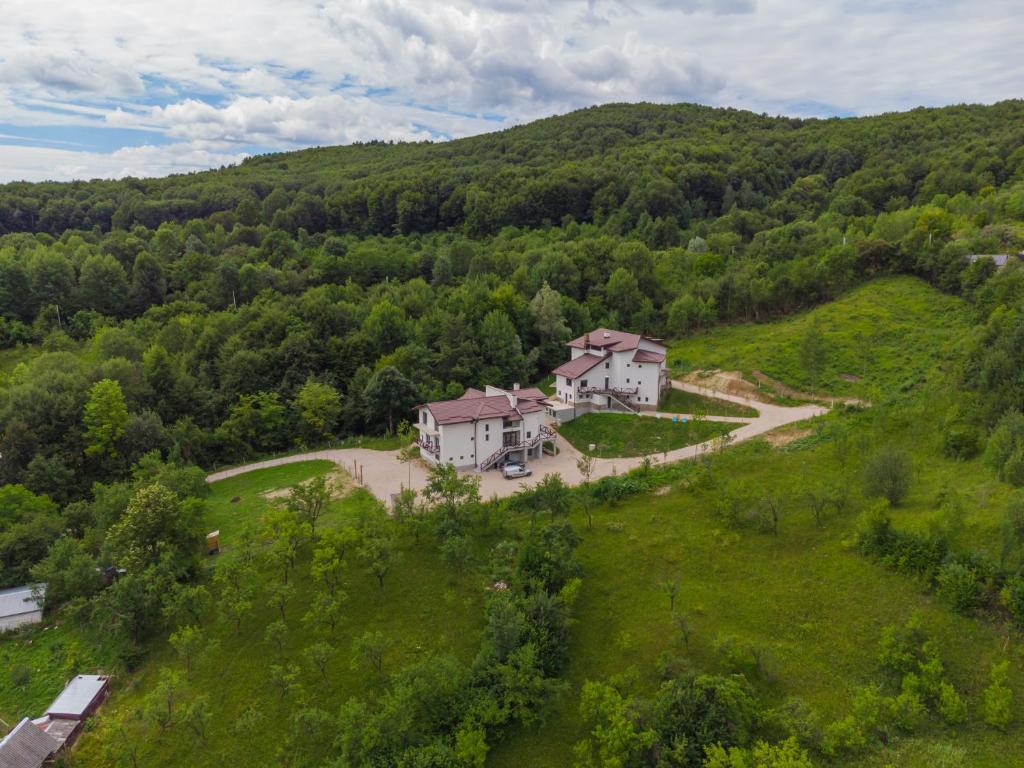 an aerial view of a house on a hill at EdMont in Pietroşiţa