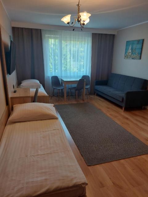 Postel nebo postele na pokoji v ubytování Willa Sternik
