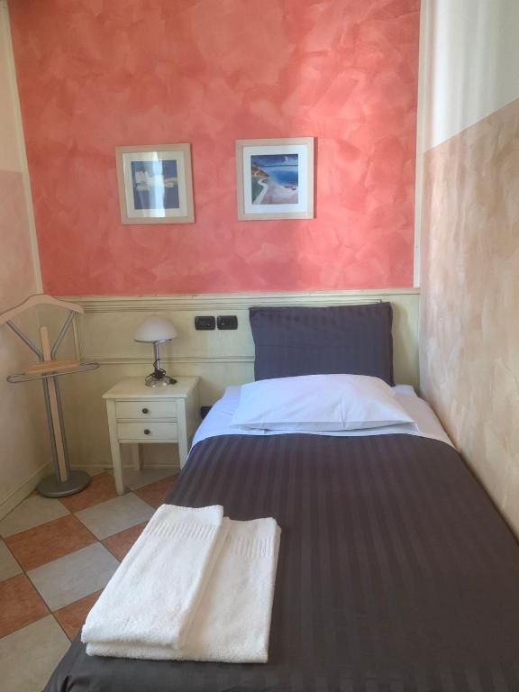 Postel nebo postele na pokoji v ubytování Hotel Due Colonne