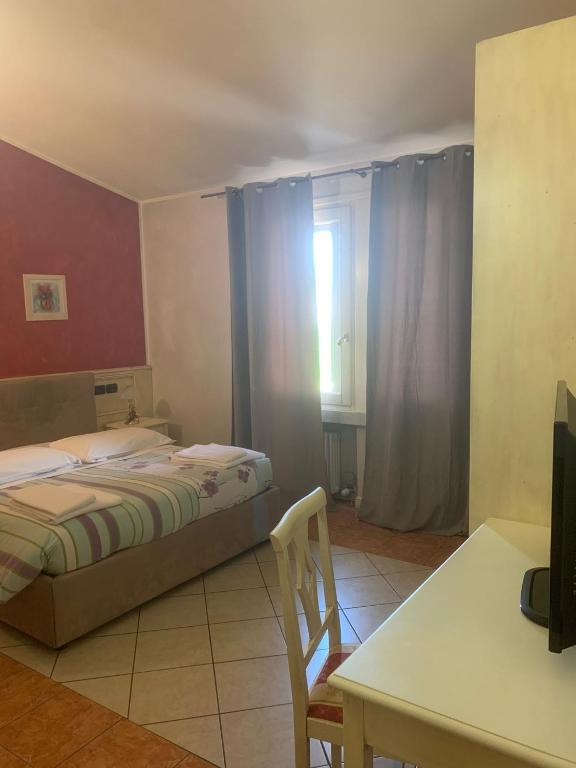 Postel nebo postele na pokoji v ubytování Hotel Due Colonne