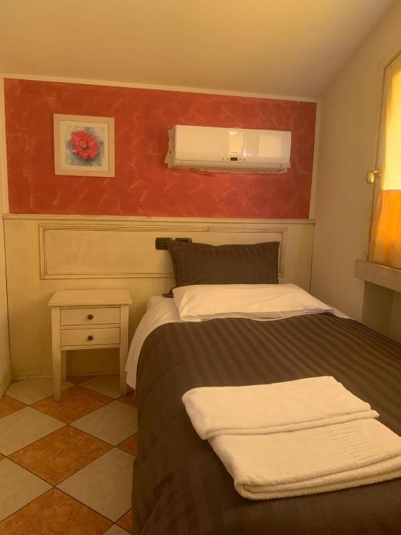 Postel nebo postele na pokoji v ubytování Hotel Due Colonne