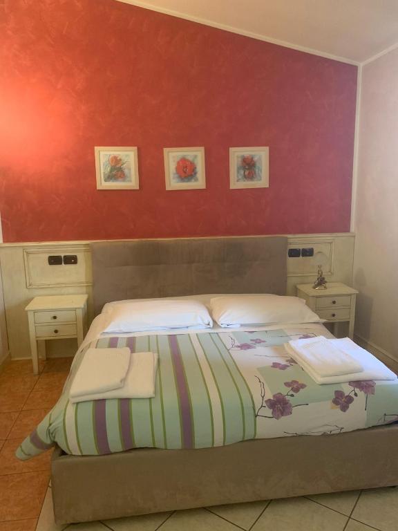 Postel nebo postele na pokoji v ubytování Hotel Due Colonne