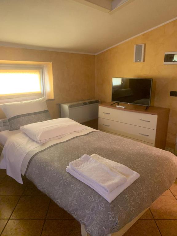 Postel nebo postele na pokoji v ubytování Hotel Due Colonne