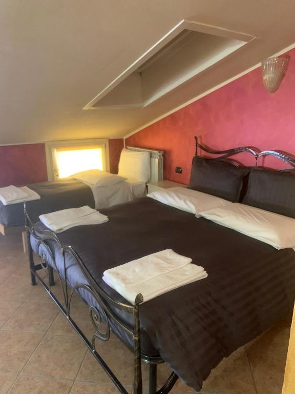 Postel nebo postele na pokoji v ubytování Hotel Due Colonne